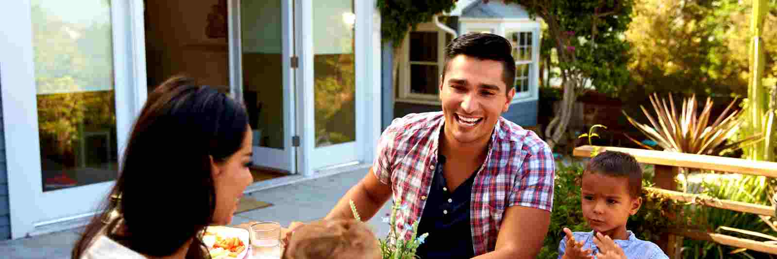 family eating outside on their patio