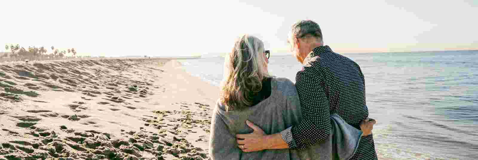 couple walking beach 