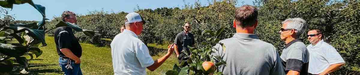 Profinium Bankers learning about an apple orchard operation