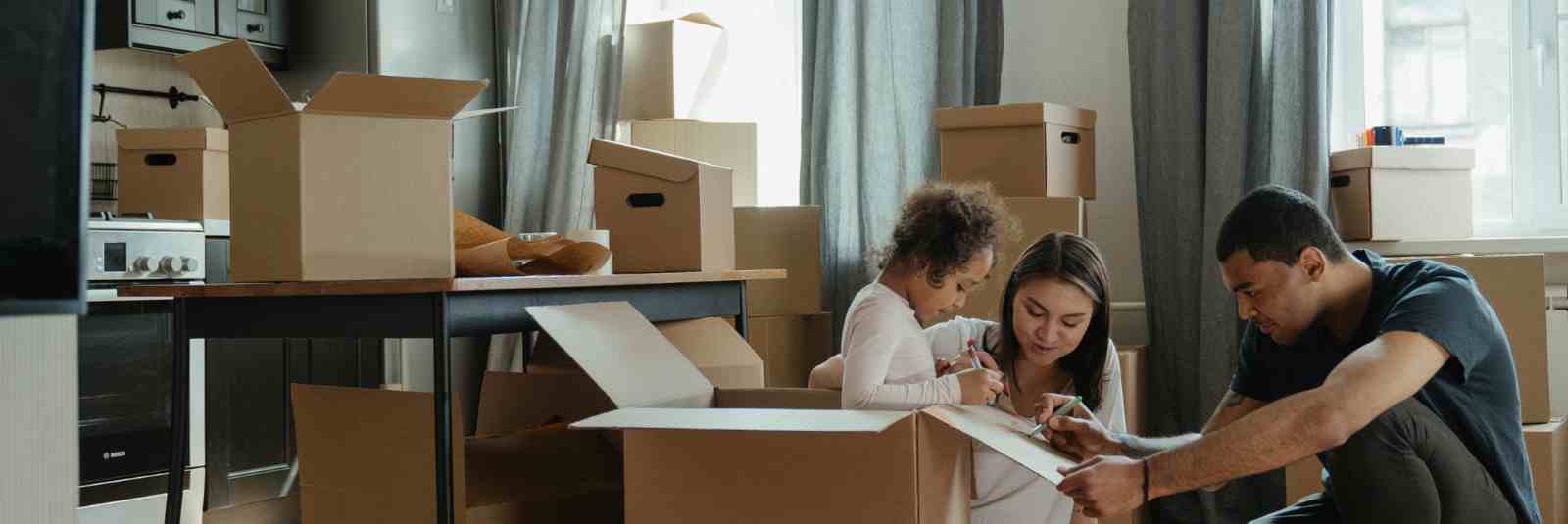 family labeling moving boxes