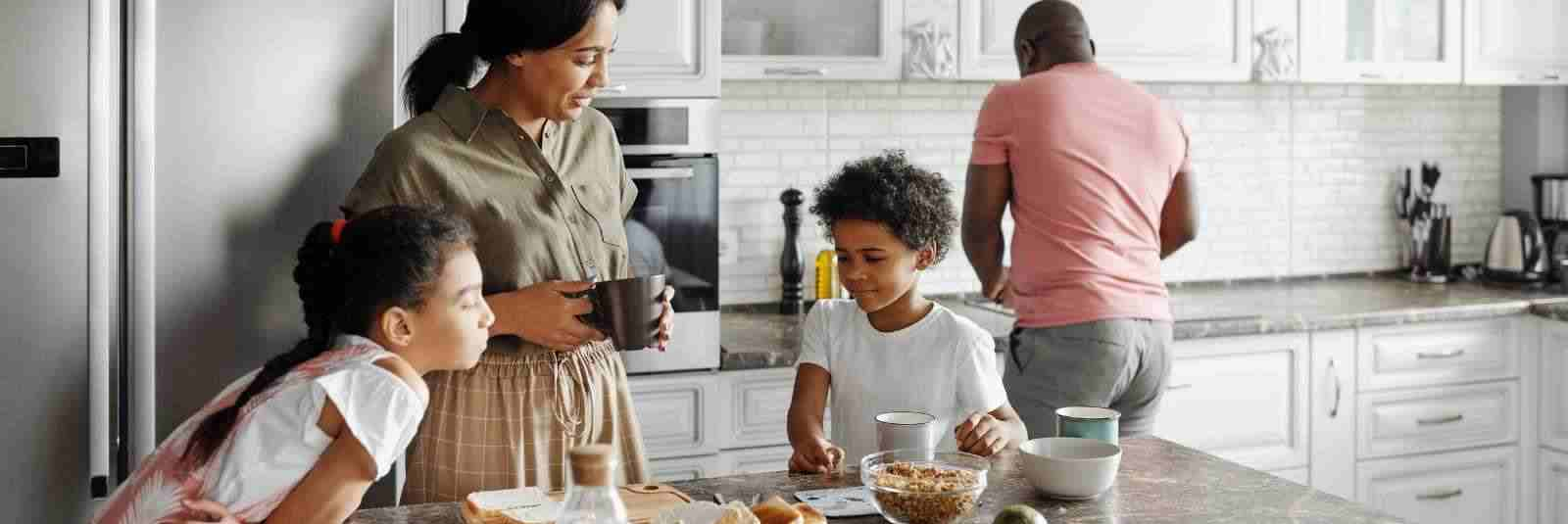 family cooking in kitchen