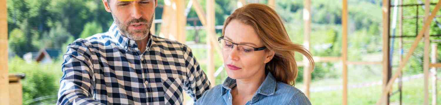 two people reviewing home building plans